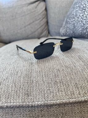 Gucci Black Rimless Sunglasses with Gold Accents -